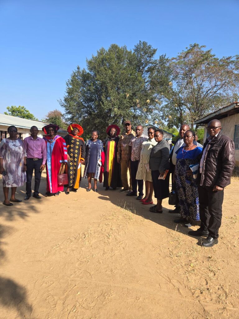 A group photograph of Dr. Mohamed Abdinoor Dahir with members of the Kitui Dons Association and other attendees at the academic clinic in Kitui East.